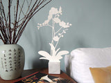 White Orchid shaped aluminum silhouette on Carrara marble base